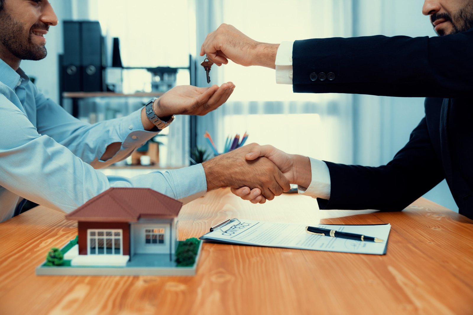 two-men-shaking-hands-house-document